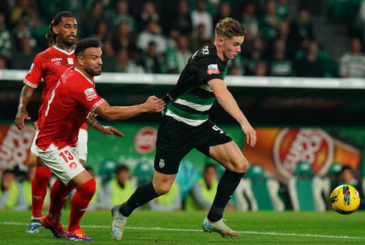 Viktor Gyokeres of Sporting CP with Luis Rocha of CD Santa