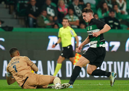 Viktor Gyokeres of Sporting CP with Gabriel Batista of CD
