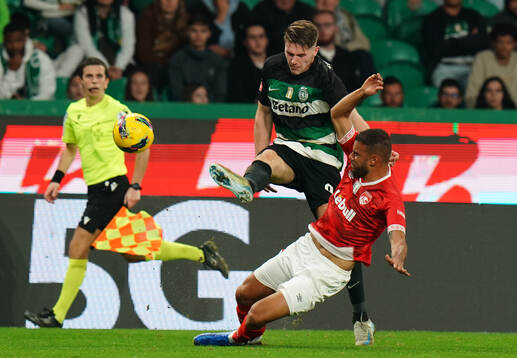 Viktor Gyokeres of Sporting CP with Pedro Ferreira of CD