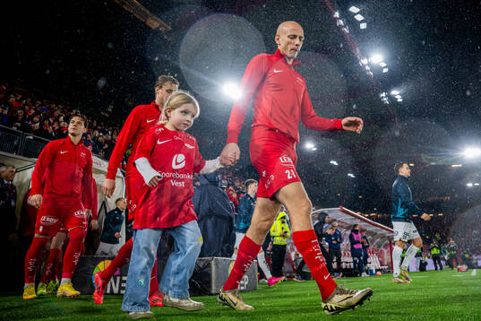Ruben Kristiansen of Brann enters the pitch with his