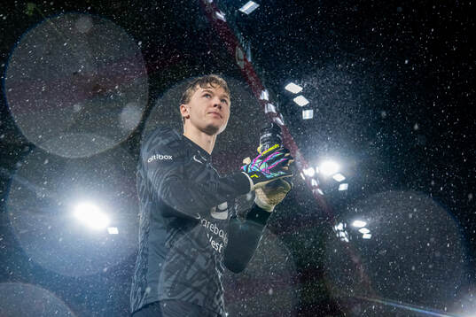 Goalkeeper Mathias Dyngeland of Brann enters the pitch