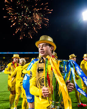 Patrick Berg of Bodø/Glimt celebrates with the trophy