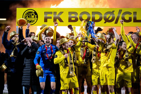 Players of Bodø/Glimt celebrate with the trophy