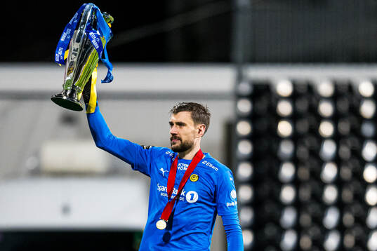 Nikita Haikin of Bodø/Glimt celebrates with the trophy