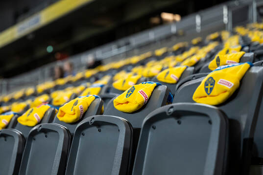 Caps with the logo of the Swedish women's national football
