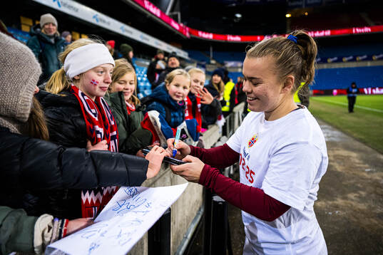 Olaug Tvedten of Norway with a fan