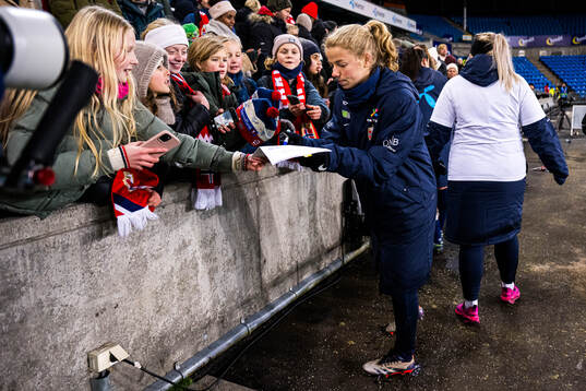 Justine Kielland of Norway with a fan