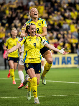 Kosovare Asllani and Fridolina Rolfö of Sweden celebrating