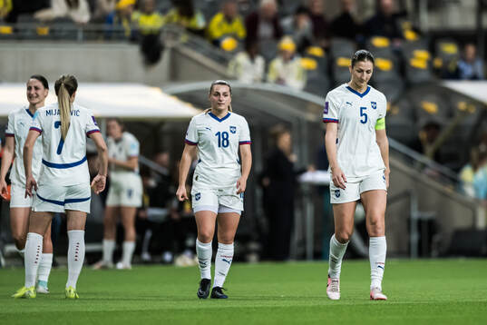 Emma Petrovic and Violeta Slovic of Serbia looks dejected