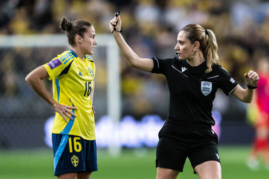 Filippa Angeldahl of Sweden and referee Eleni Antoniou