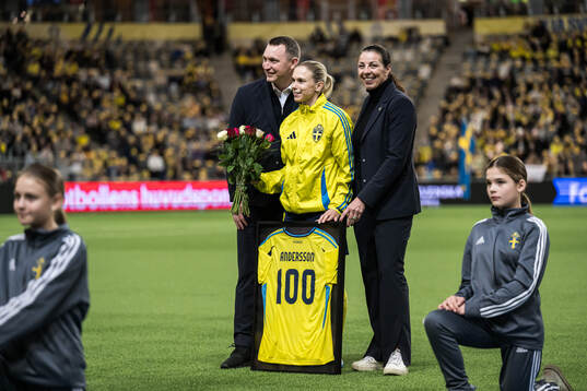 Jonna Andersson of Sweden is celebrated for 100 games with