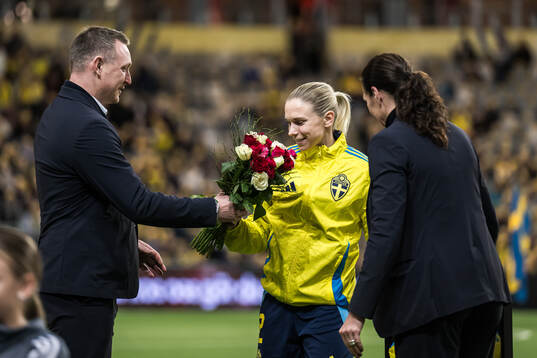 Jonna Andersson of Sweden is celebrated for 100 games with