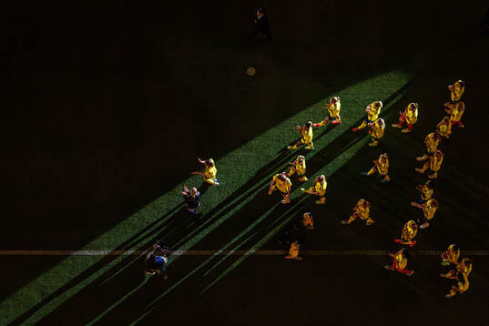 Caroline Seger walks in front of players of Sweden