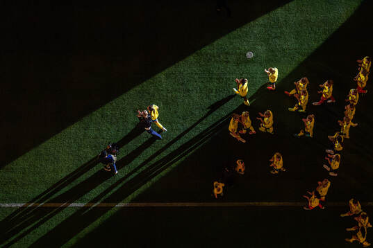 Caroline Seger walks in front of players of Sweden
