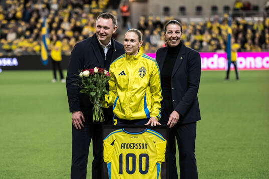 Jonna Andersson of Sweden is celebrated for 100 games with