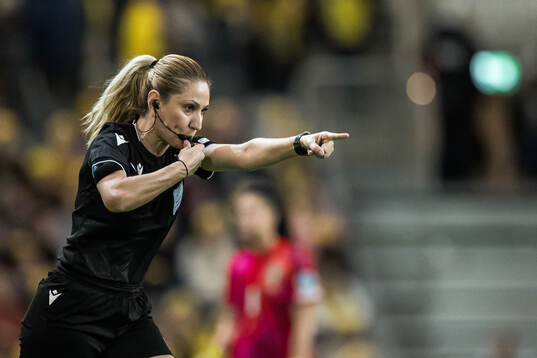 Referee Eleni Antoniou point for penalty