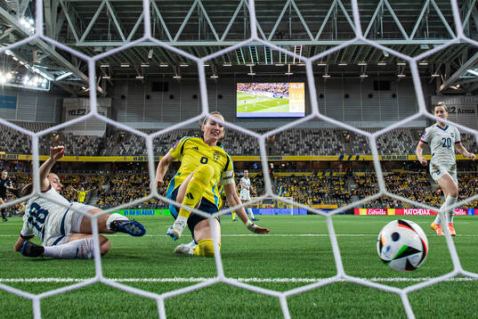 Kosovare Asllani of Sweden scores the 2-0 goal