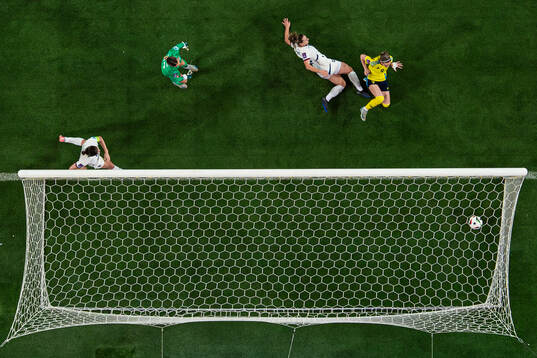 Kosovare Asllani of Sweden scores the 2-0 goal behind