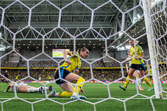 Kosovare Asllani and Fridolina Rolfö of Sweden celebrate