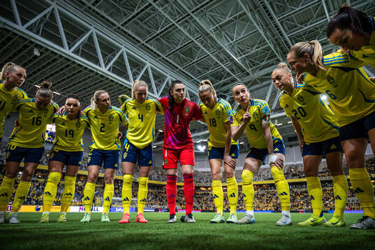 Kosovare Asllani of Sweden speaks to her teammates