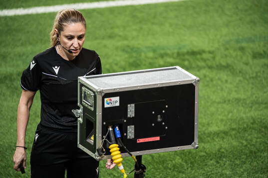 Referee Eleni Antoniou at a VAR situation