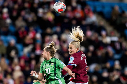 Natalie Johnson of Northern Ireland and Guro Bergsvand of
