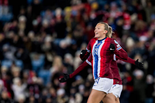 Synne Sofie Kinden Jensen of Norway celebrates scoring the