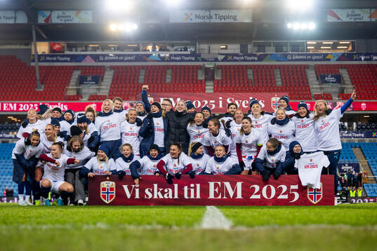 Players and staff of Norway celebrate
