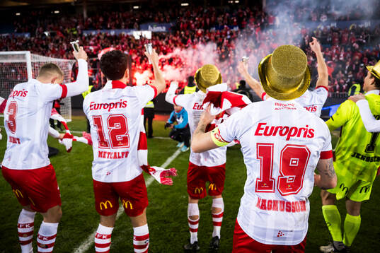 The players of Fredrikstad celebrate infront of their