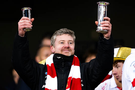 Andreas Hagen, head coach of Fredrikstad, celebrates with