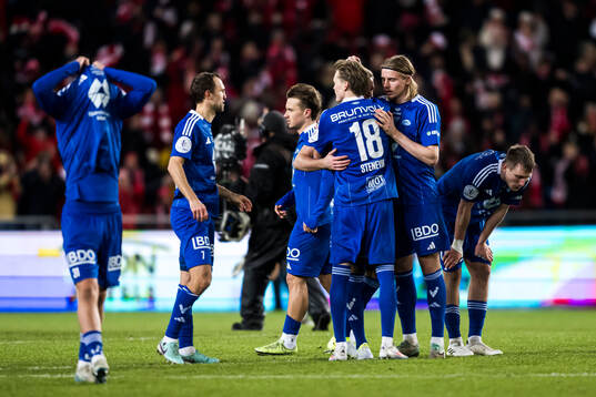 Players of Molde look dejected