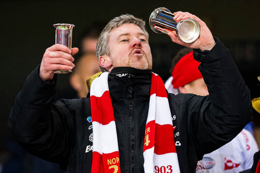 Andreas Hagen, head coach of Fredrikstad, celebrates with