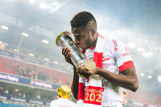 Mai Traore of Fredrikstad celebrates with the trophy