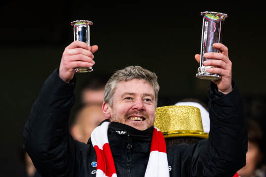 Andreas Hagen, head coach of Fredrikstad, celebrates with