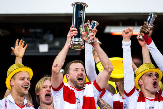 Simen Rafn of Fredrikstad celebrates with the trophy