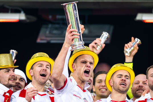 Morten Bjørlo of Fredrikstad celebrates with the trophy
