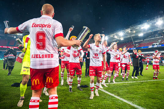 Morten Bjørlo of Fredrikstad celebrates with the trophy
