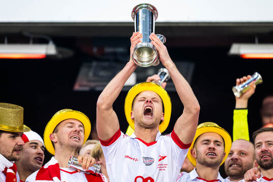 Morten Bjørlo of Fredrikstad celebrates with the trophy