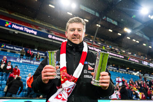 Andreas Hagen, head coach of Fredrikstad, celebrates with