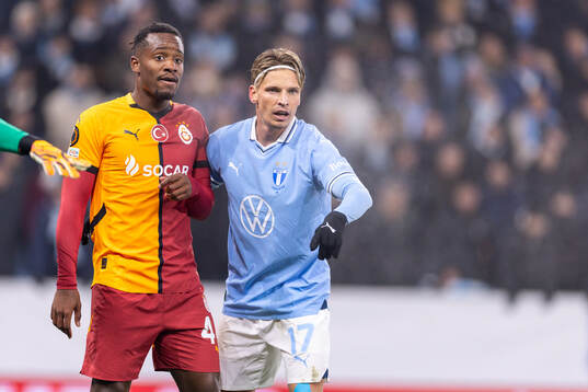 Michy Batshuayi of Galatasaray and Jens Stryger Larsen of