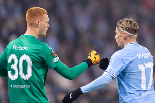 goalkeeper Joakim Persson and Jens Stryger Larsen of Malmö