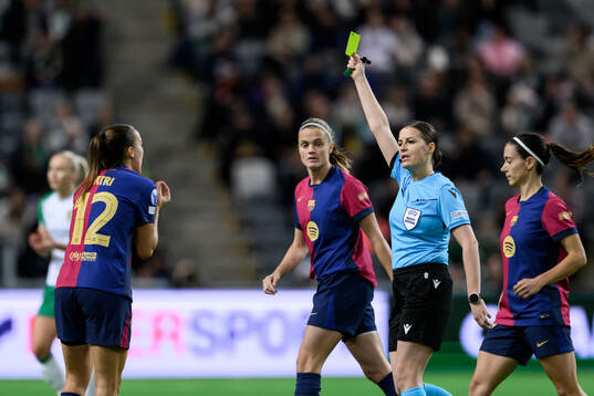 Patri Guijarro of Barcelona receives a yellow card from