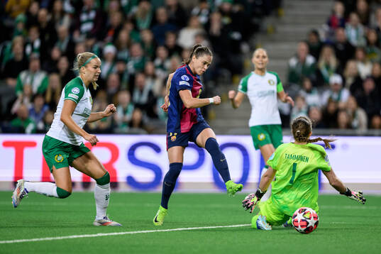 Ewa Pajor of Barcelona scores 0-1 behind goalkeeper Anna