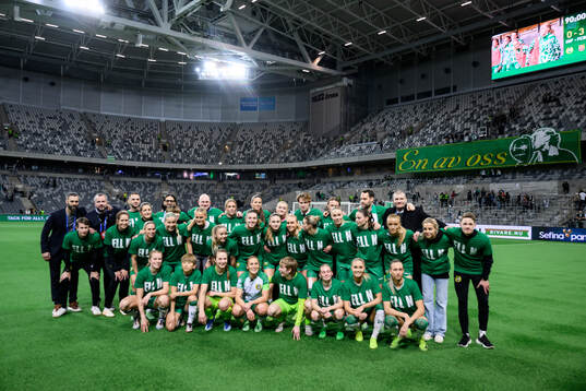Ellen Gibson of Hammarby is celebrated by team mates as she