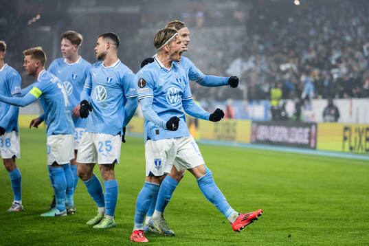 Jens Stryger Larsen and Erik Botheim of Malmö FF celebrate