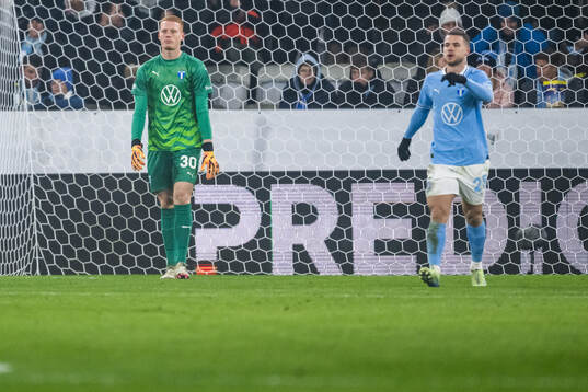 Goalkeeper Joakim Persson and Gabriel Busanello of Malmö