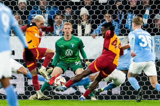Goalkeeper Joakim Persson of Malmö FF and Victor Osimhen