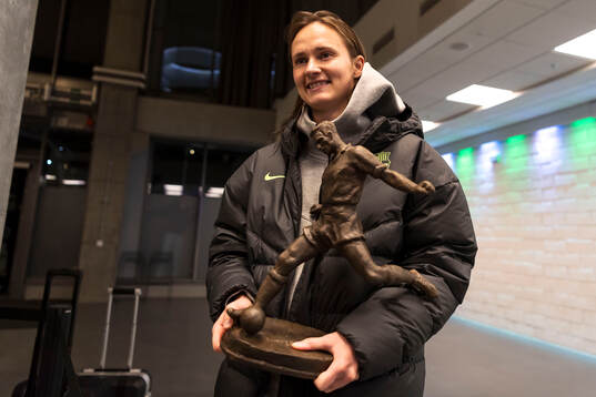 Caroline Graham Hansen of Barcelona receives