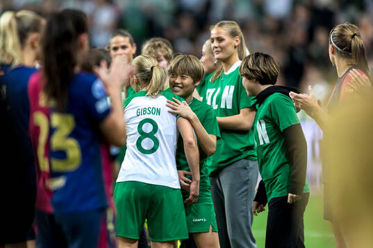 Ellen Gibson of Hammarby is celebrated by Suzu Amano as she