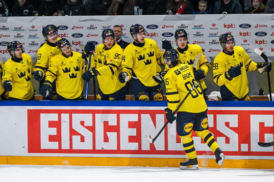 Mathias Brome of Sweden celebrates with team mates